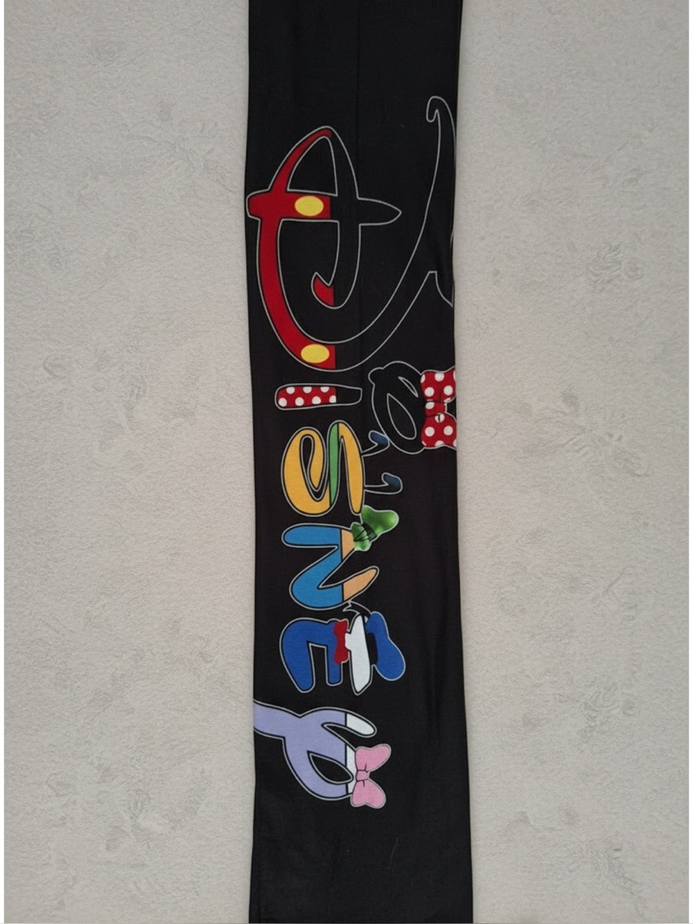 Women’s NWOT,  Black Leggings featuring Disney Character Logo down Left Leg
